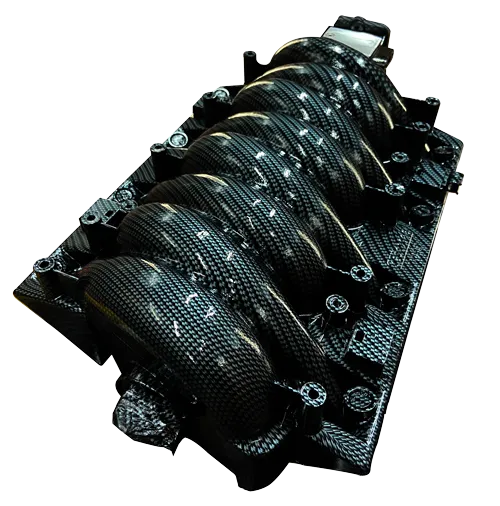 An intake manifold finished in a carbon fibre hydrographic film